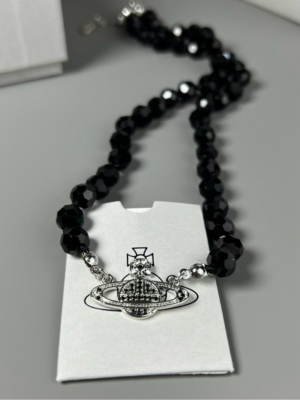 Faceted Black Bead Necklace with Silver Orb Pendant